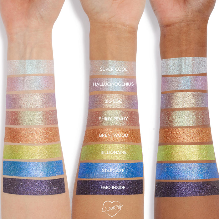 ColourPop Jelly Much Shadow in Stargaze swatched as a vivid cobalt-blue metallic stripe on three forearms, shown with other labeled shades for comparison, highlighting high-shine shimmer, opaque payoff, and jelly-cream texture.