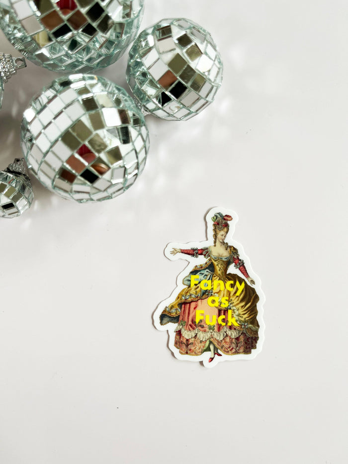 Funny "Fancy as Fuck" sticker by The Coin Laundry, featuring bold lettering on a colorful background suitable for decorating laptops or notebooks.