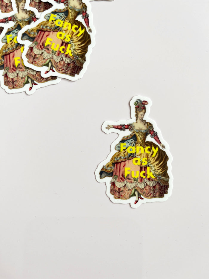 Funny "Fancy as F***" sticker by The Coin Laundry, featuring bold, colorful lettering on a clear adhesive backing.