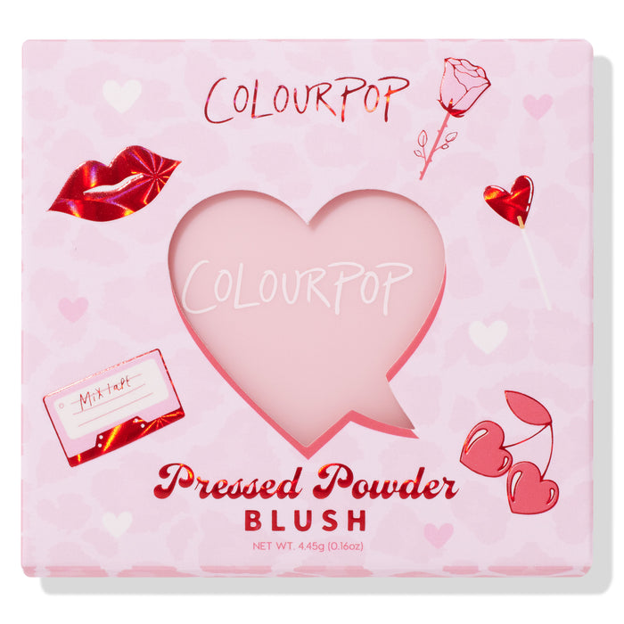 Sweetheart shade ColourPop Pressed Powder Blush sits behind a heart-shaped cutout, showcased in a pink Valentine-themed box with red foil lips, rose, heart lollipop, cherries, and mixtape graphics; 4.45 g (0.16 oz) pan.