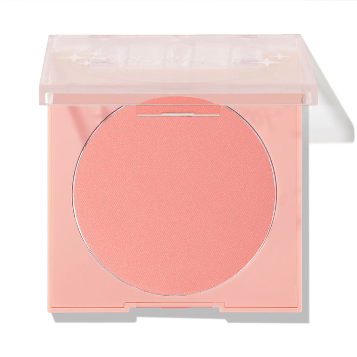 Swirled ColourPop Pressed Powder Blush shown half-open, a soft peachy‑pink pan in a pale pink square compact with a translucent lid, photographed on a white background for product display.