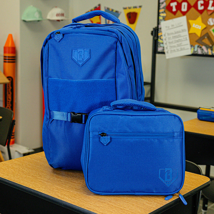 Adult model wearing blue lunch box with "SZN 2" design