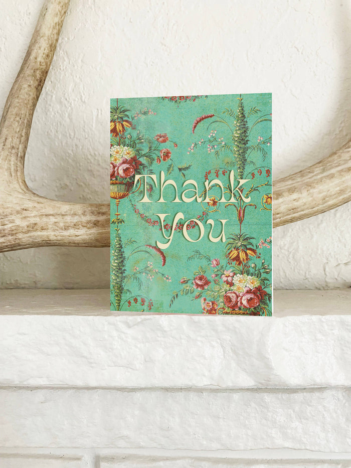 Mint green floral thank you card from The Coin Laundry featuring elegant flower illustrations on greeting card.