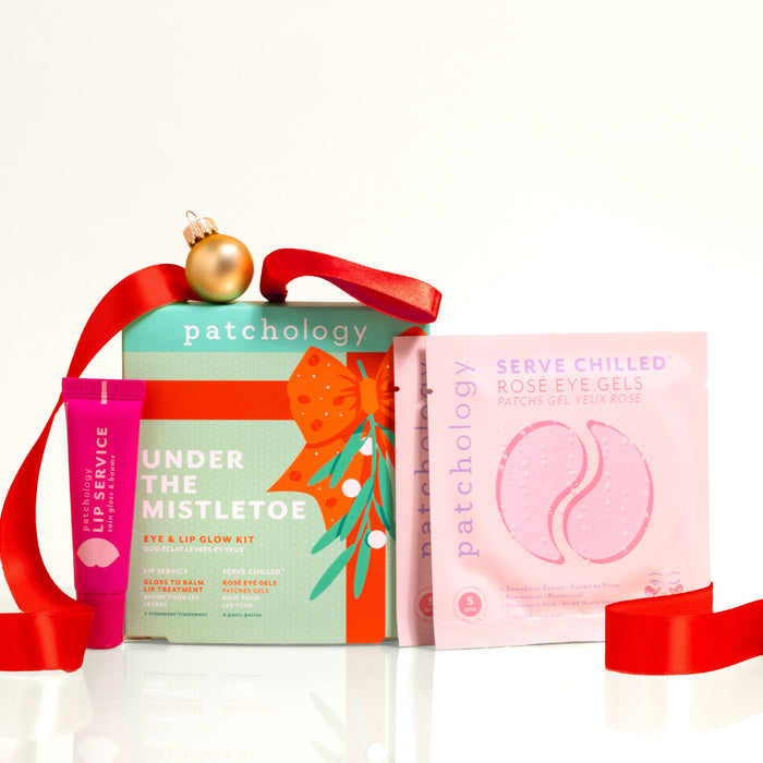 Skincare lip and eye mask products with a red ribbon on a white background