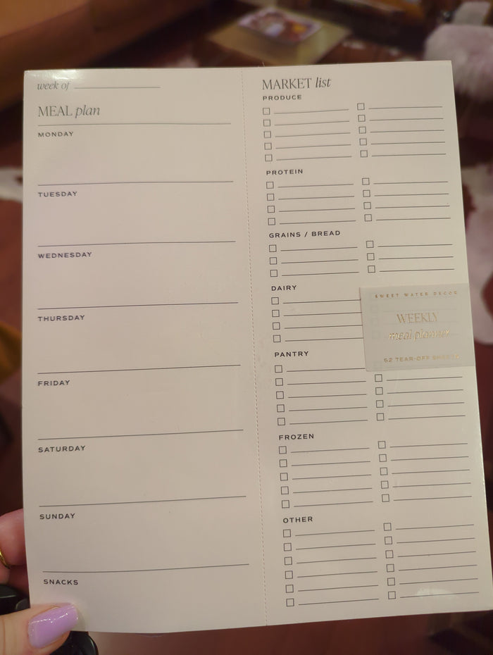 Weekly Meal Plan Notepad by Sweet Water Decor showing a clean, organized notepad with meal planning sections and colorful headers.