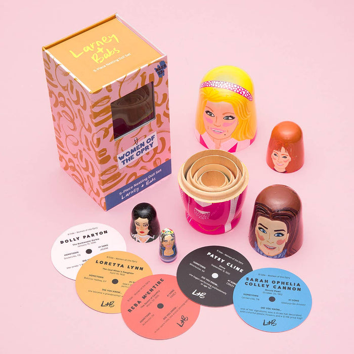 Set of wooden nesting dolls featuring women of country design by Larney + Babs, perfect as a decorative gift.